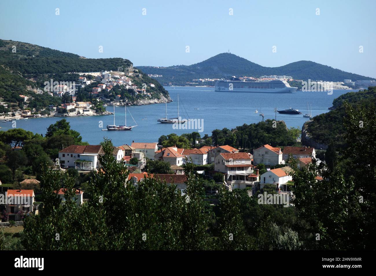 A luxury cruise ship passing Zaton Bay as it leaves Dubrovnik, Croatia. Stock Photo