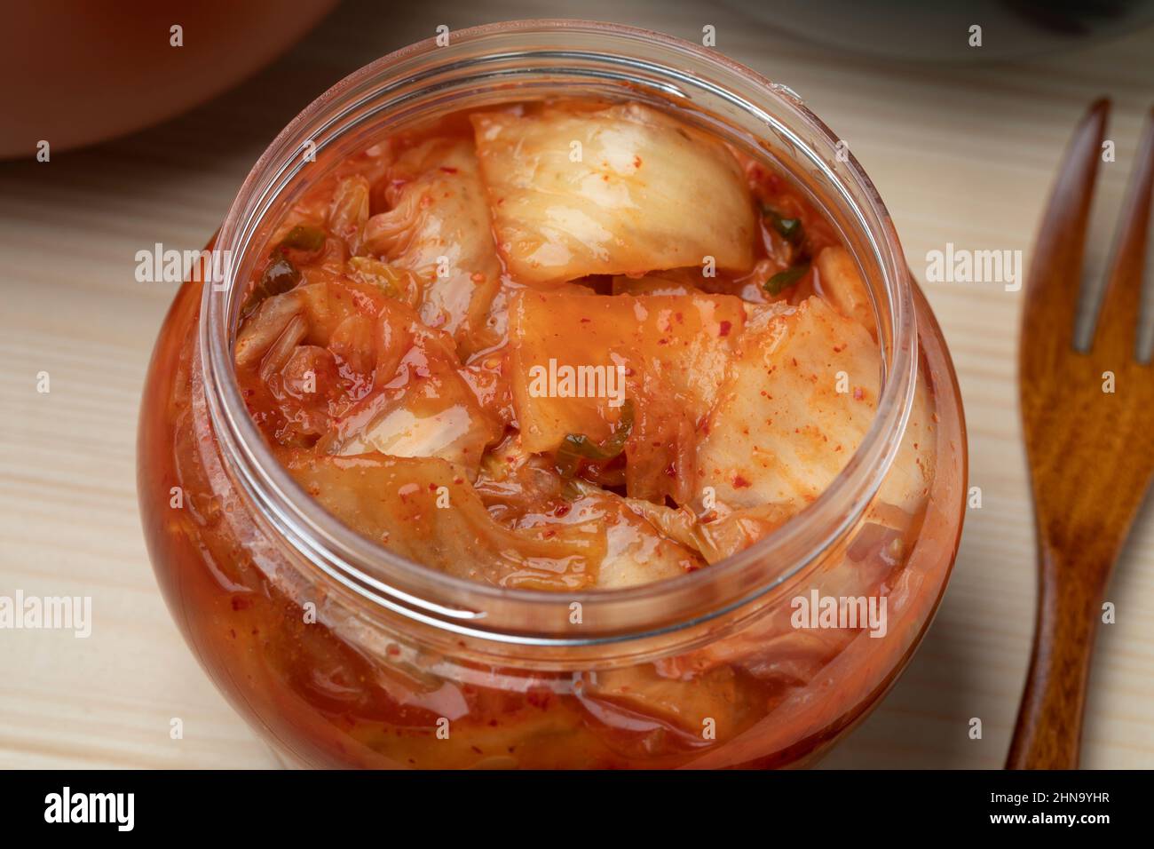 Glass jar with traditional Korean fermented Kimchi close up Stock Photo