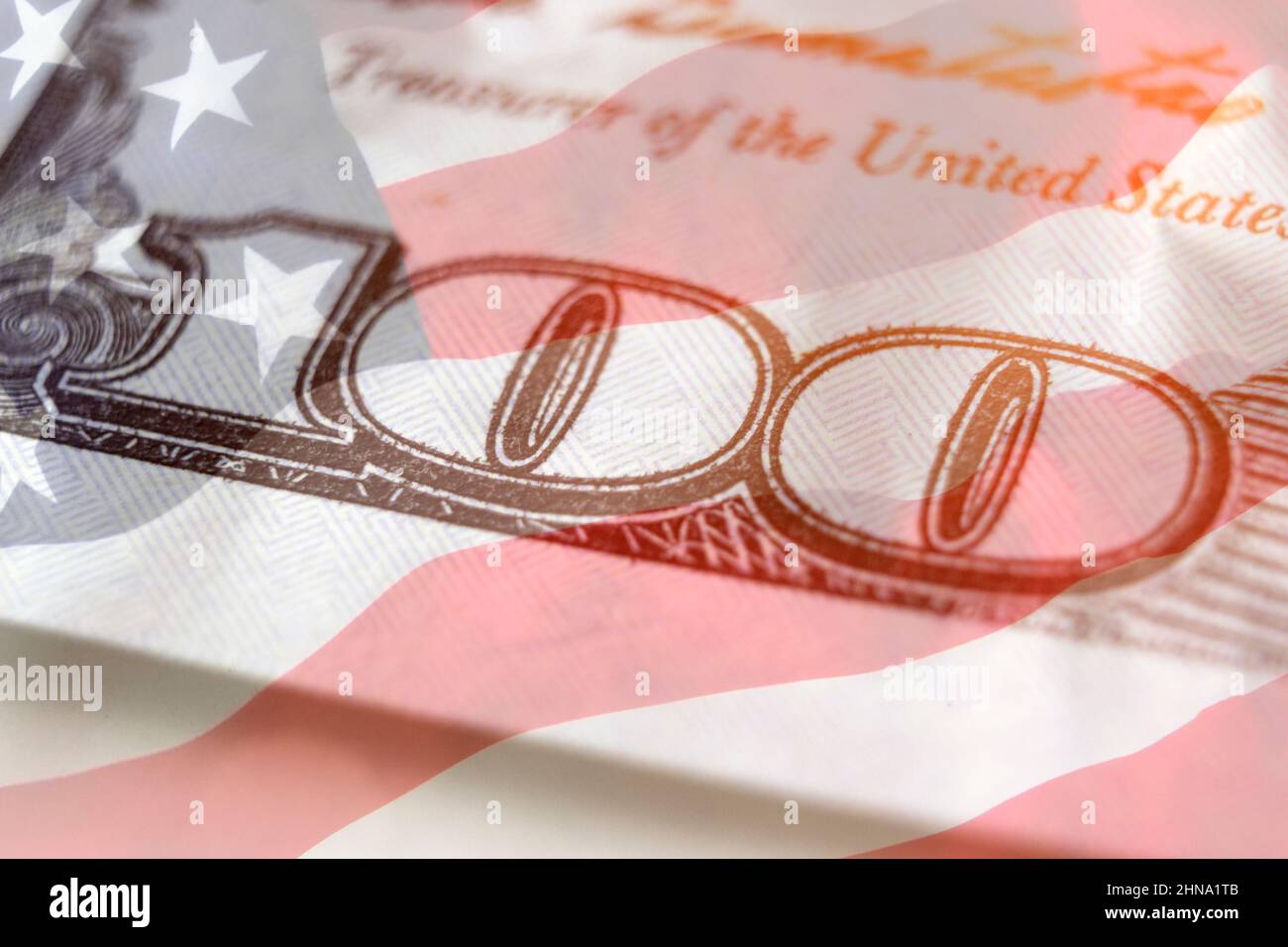 United states hundred dollars money bill on american flag background. US dollar background. 100. Economy, savings and the US dollar Stock Photo