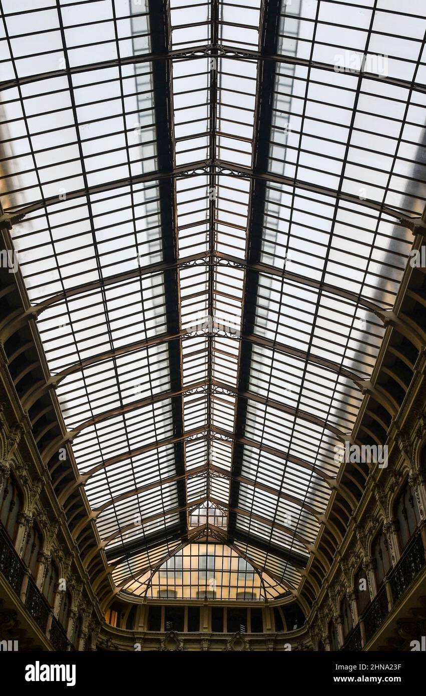 Low angle view of the glass roof of the Galleria Subalpina (1873), a covered shopping gallery located in the historic centre of Turin, Piedmont, Italy Stock Photo