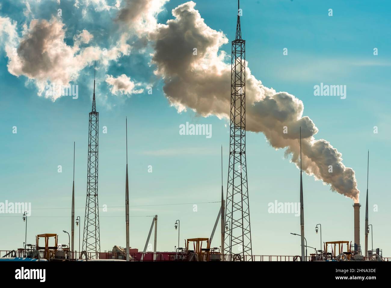 Industrial emissions from pipes into the atmosphere. Environmental