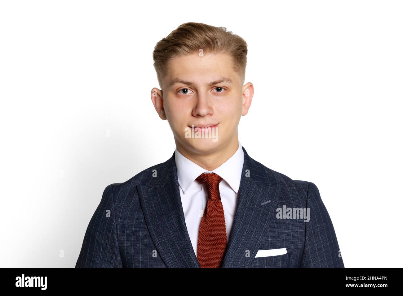 Half-length portrait of handsome young businessman, student, diplomat looking at camera isolated on white studio background. Human emotions, facial Stock Photo