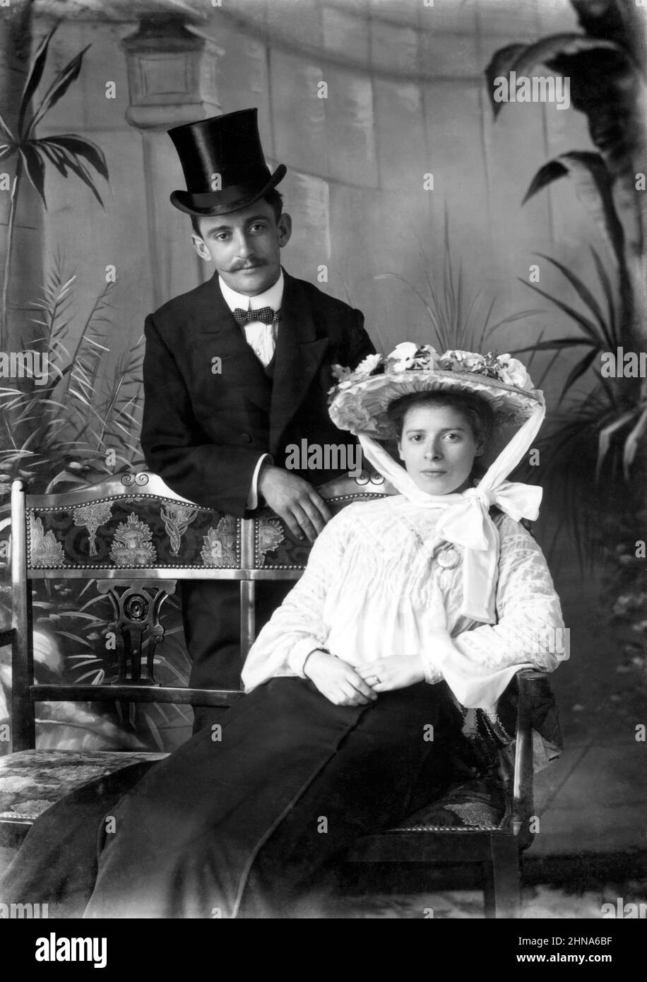 Late Victorian studio portrait of well-dressed, wealthy couple wearing formal dress Stock Photo