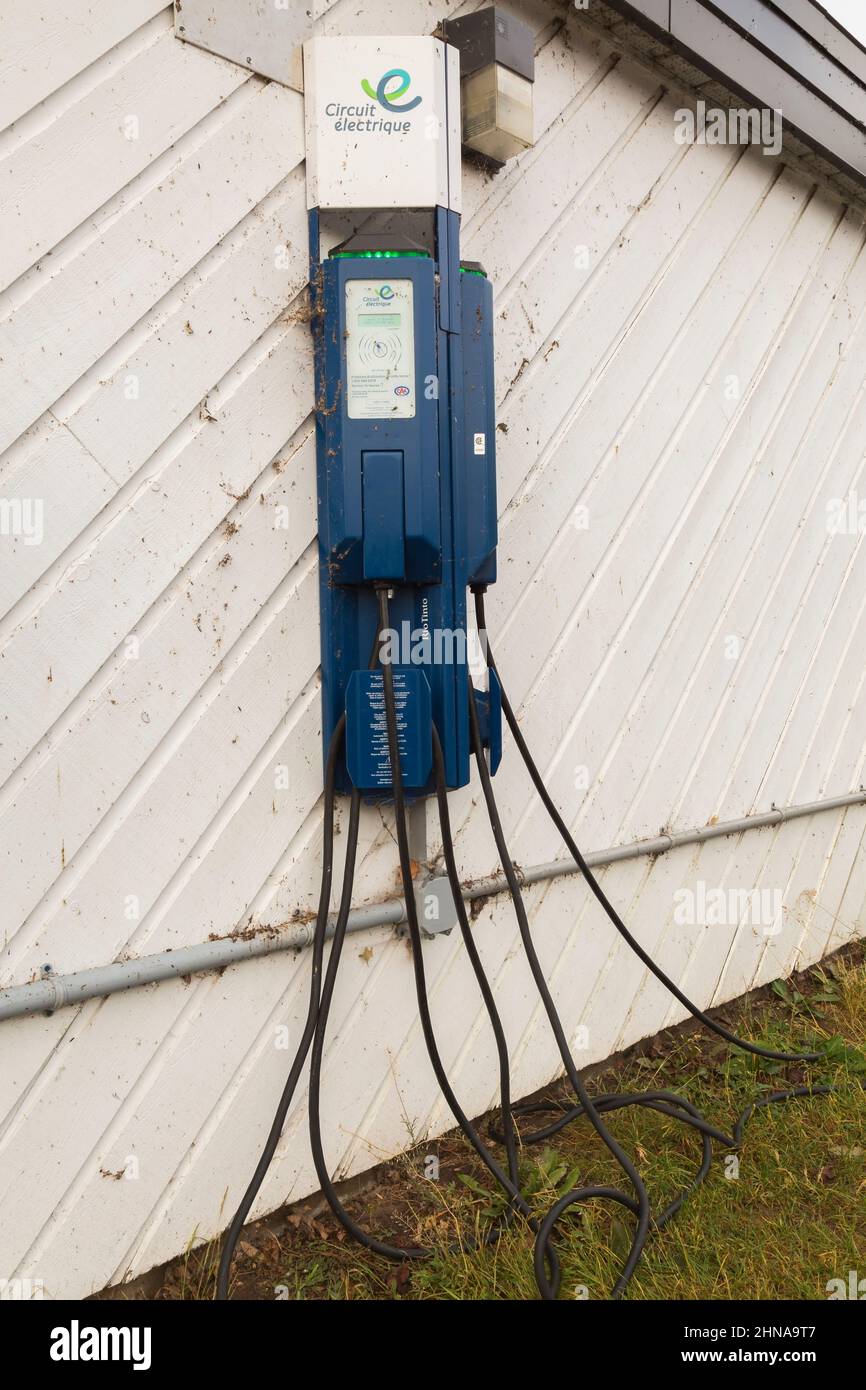 EV charging station on exterior wall of building, Old Terrebonne