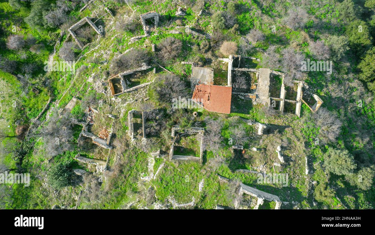 Ruins of traditional stone houses, rural depopulation in Cyprus. Aerial ...