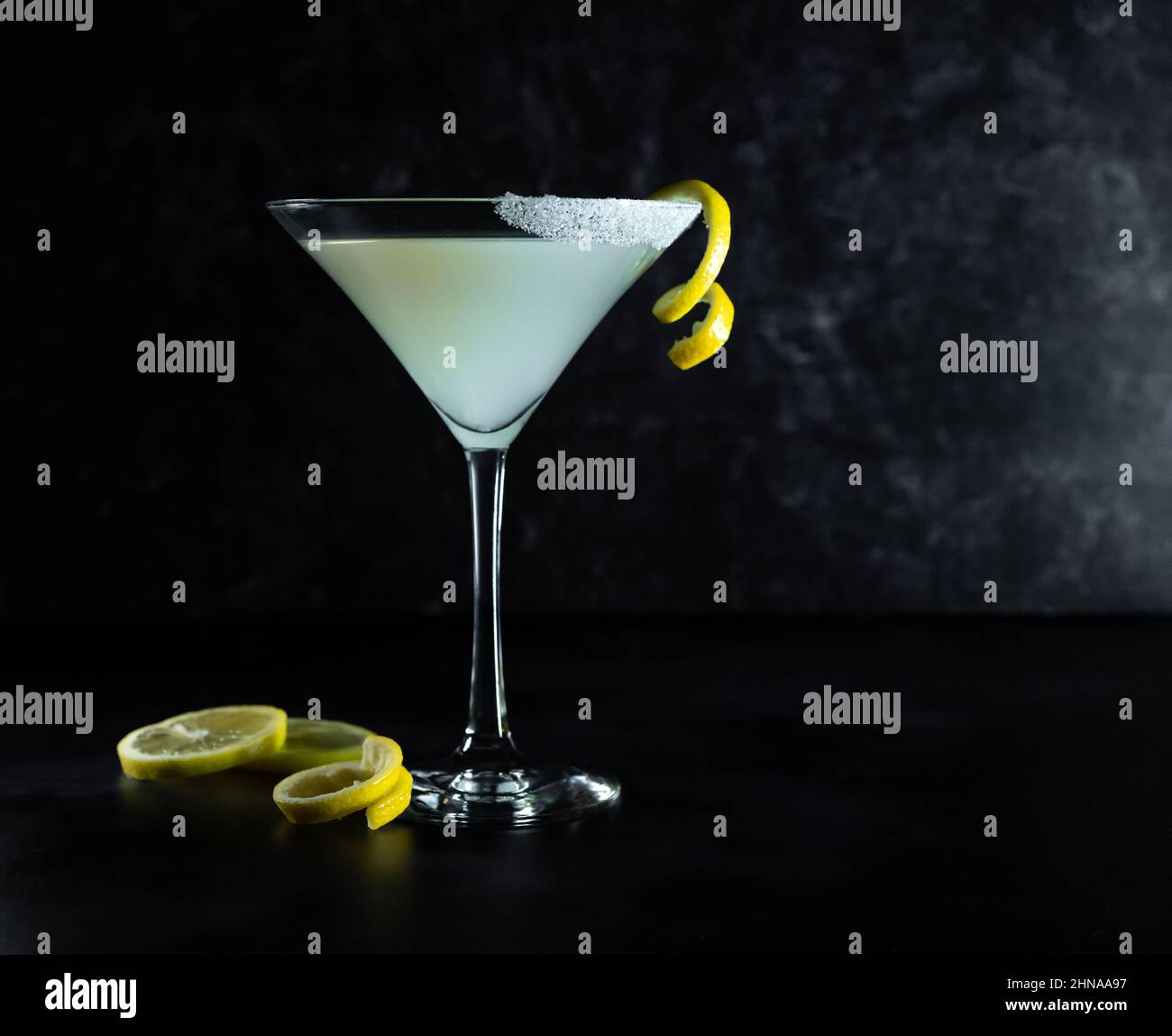 Lemon Drop Martini on dark background with lemon twist Stock Photo