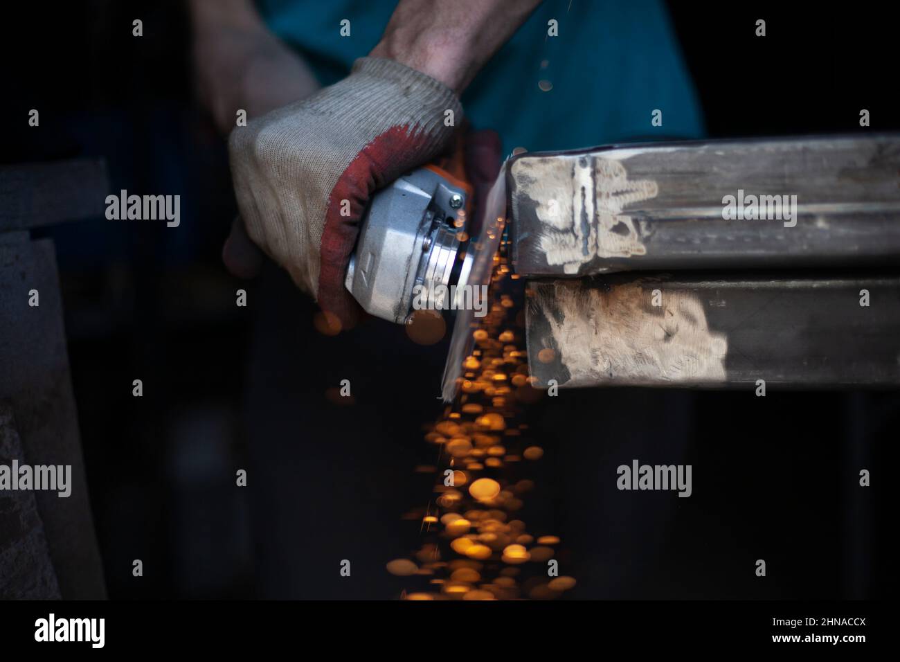 Metal cutting. Grinding steel. Work as a grinder Stock Photo Alamy