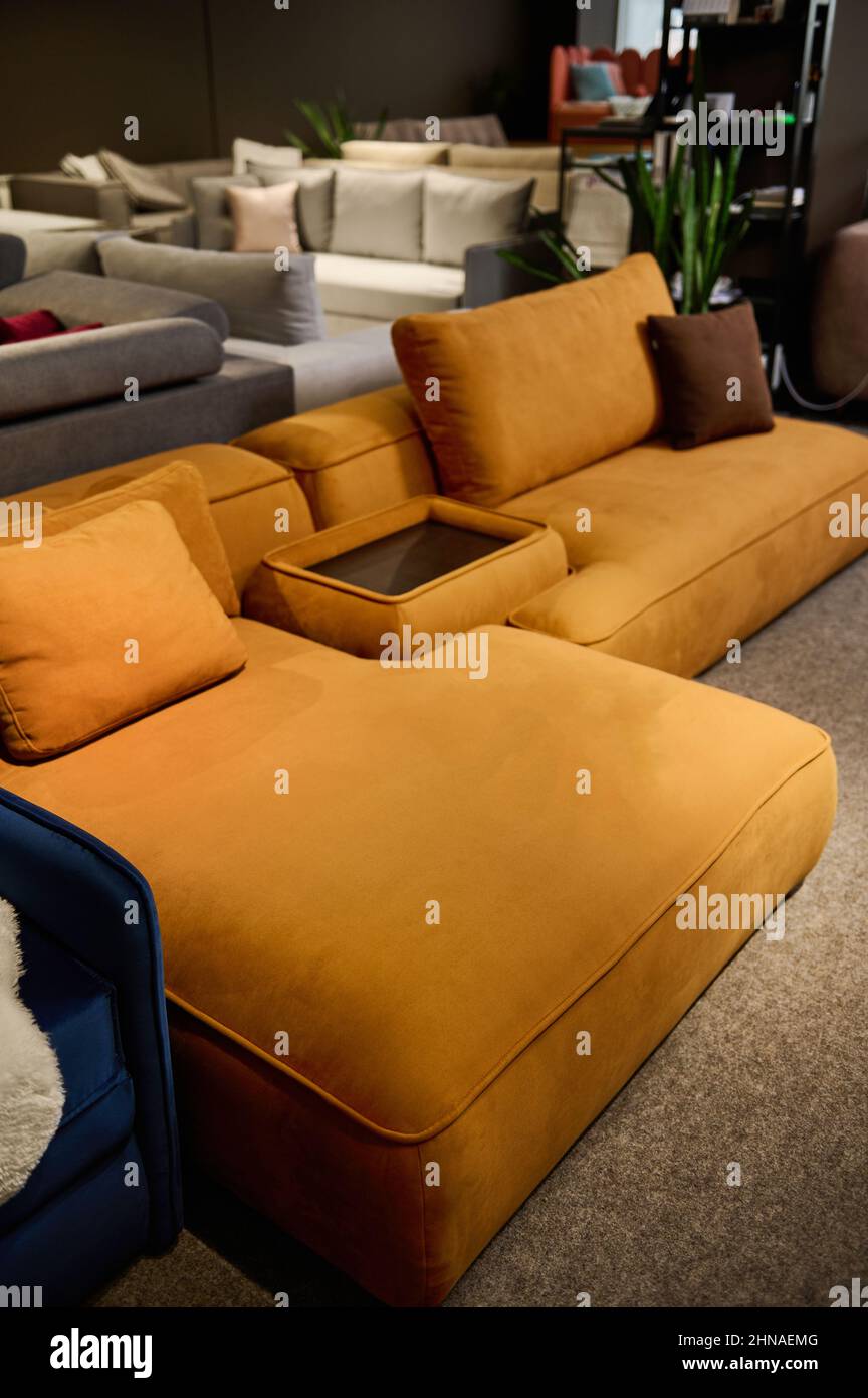 Showroom of modern luxury furniture store. Sofas exhibited in the