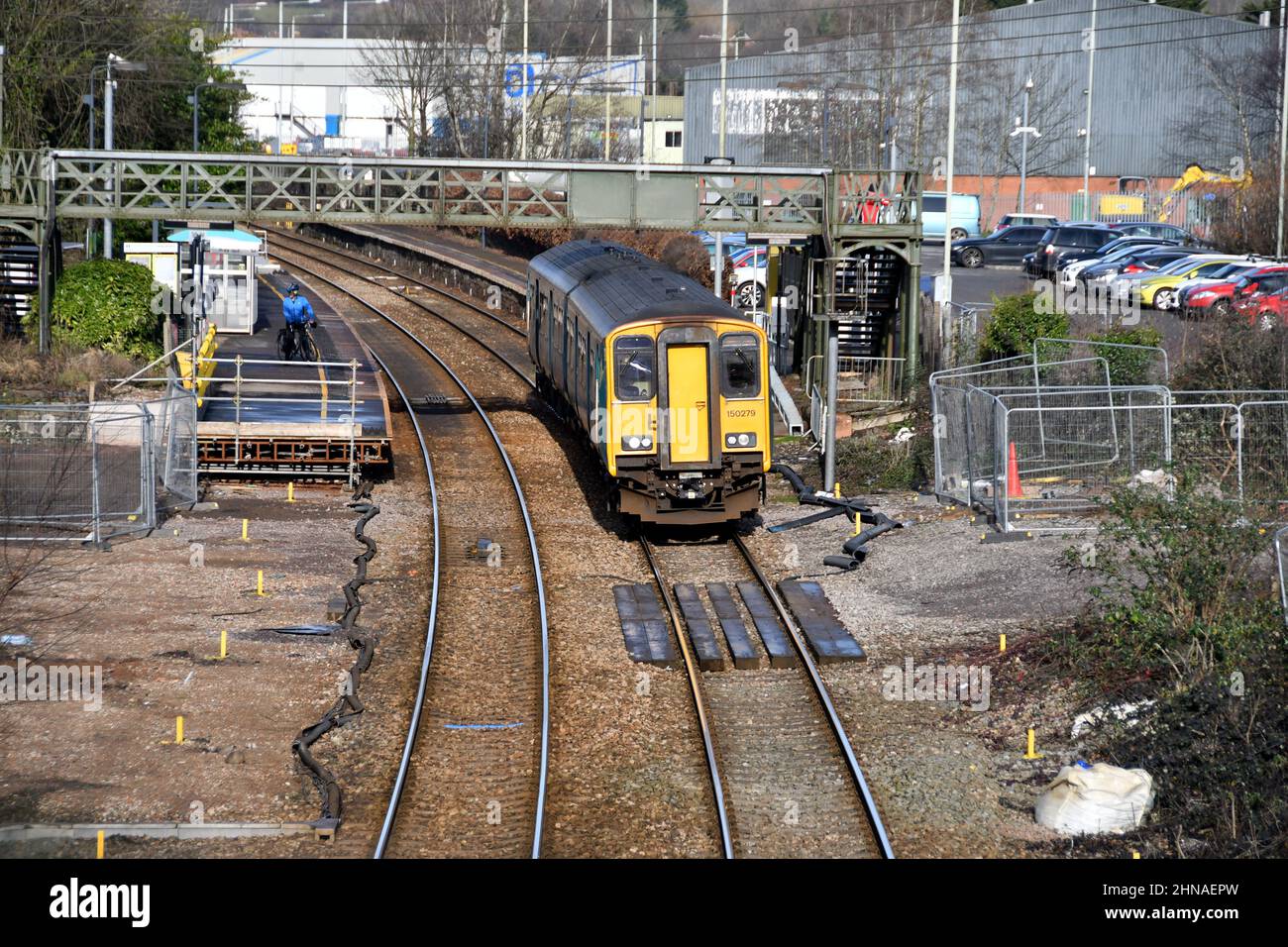 Taffs Well, Wales - February 2022: Local train leaving the village railway station, which is undergoing improvements for the South Wales Metro Stock Photo