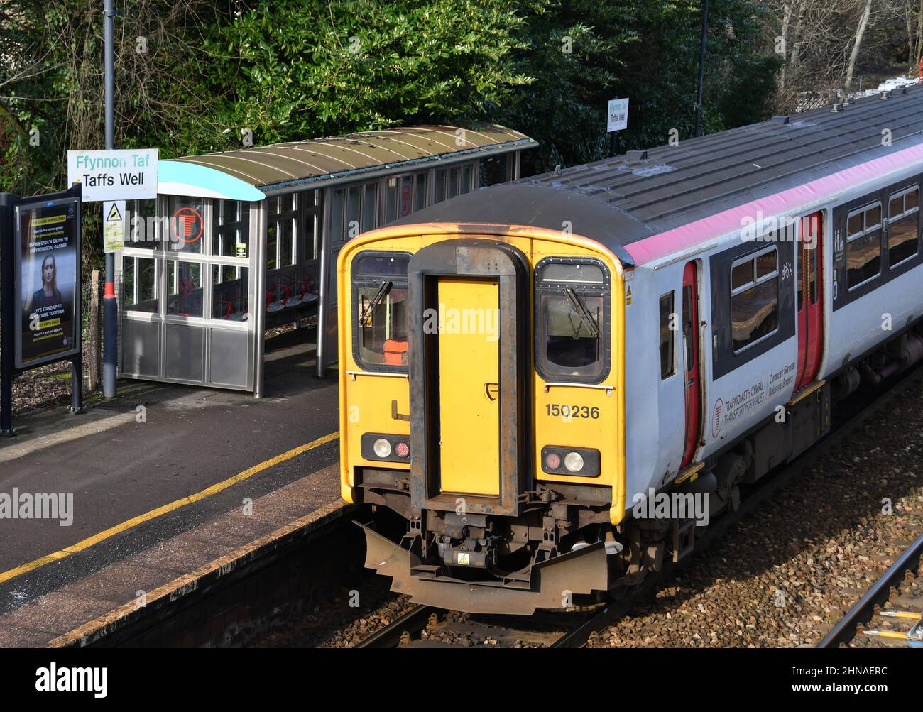 Taffs Well, Wales - February 2022: Local commuter train on the Valley Lines stopped at the village railway station in Taffs Well. Stock Photo