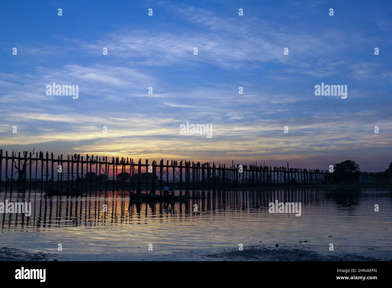 Sunset at the U Bein Bridge at the Taungthaman Lake near Amarapura ...