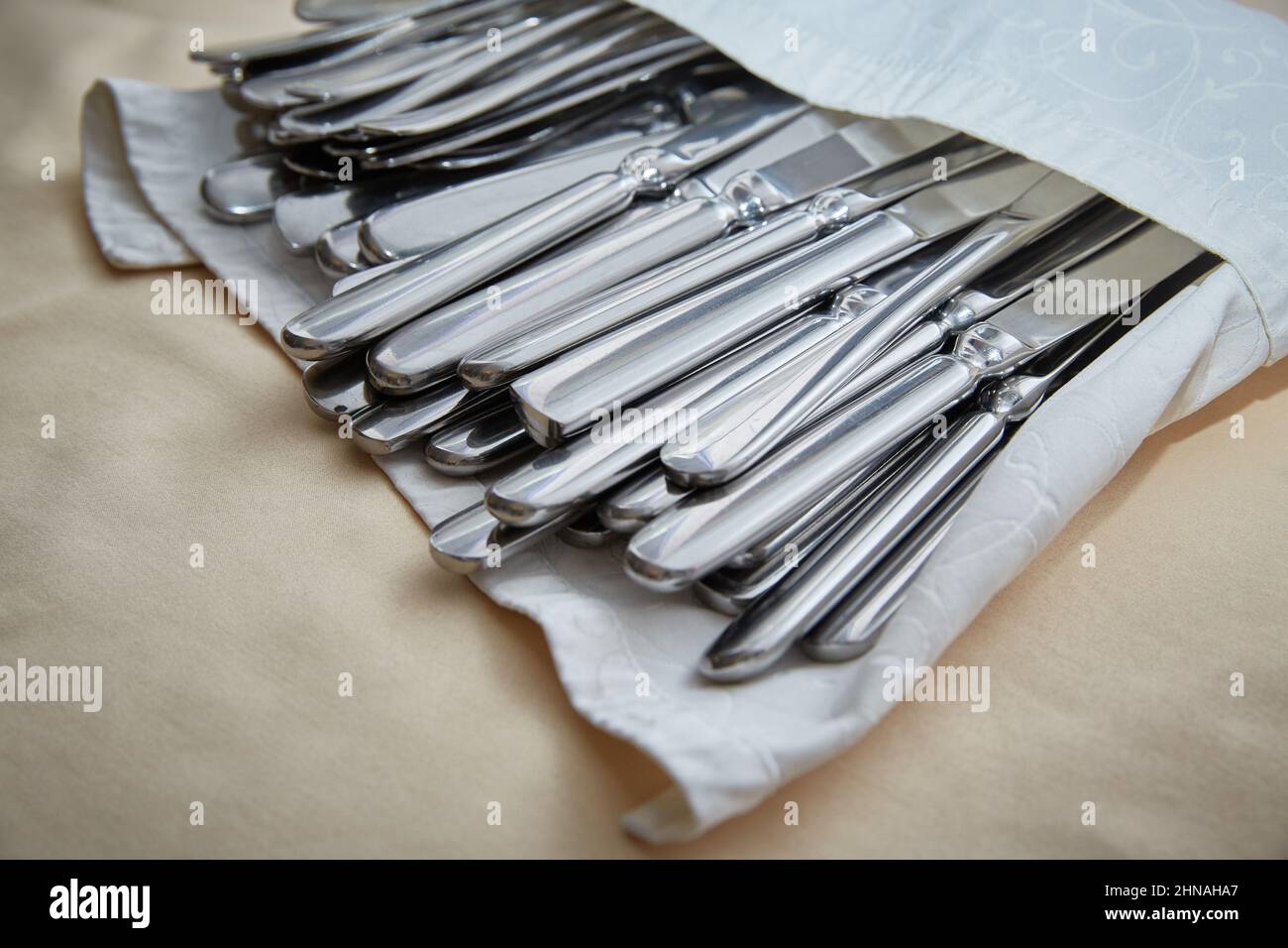 There are a lot of cutlery in a napkin in a restaurant Stock Photo Alamy