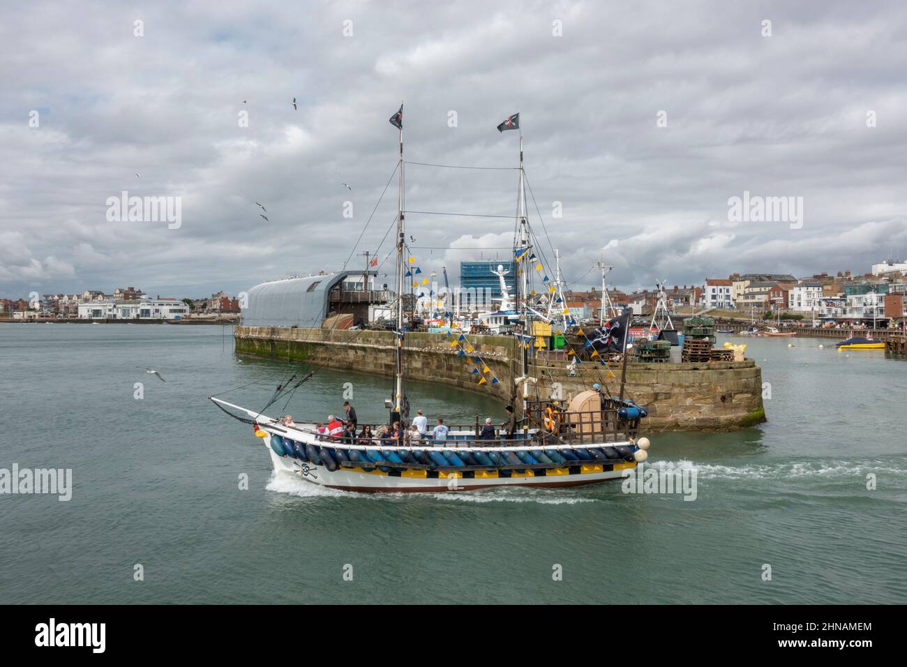 The Pirate Ship boat tour boat departing the harbour in Bridlington, East Yorkshire, UK. Stock Photo