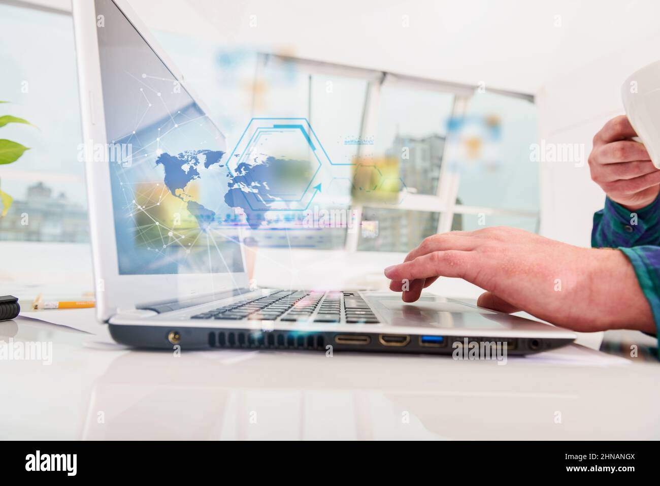 Man works with laptop with internet streaming service Stock Photo