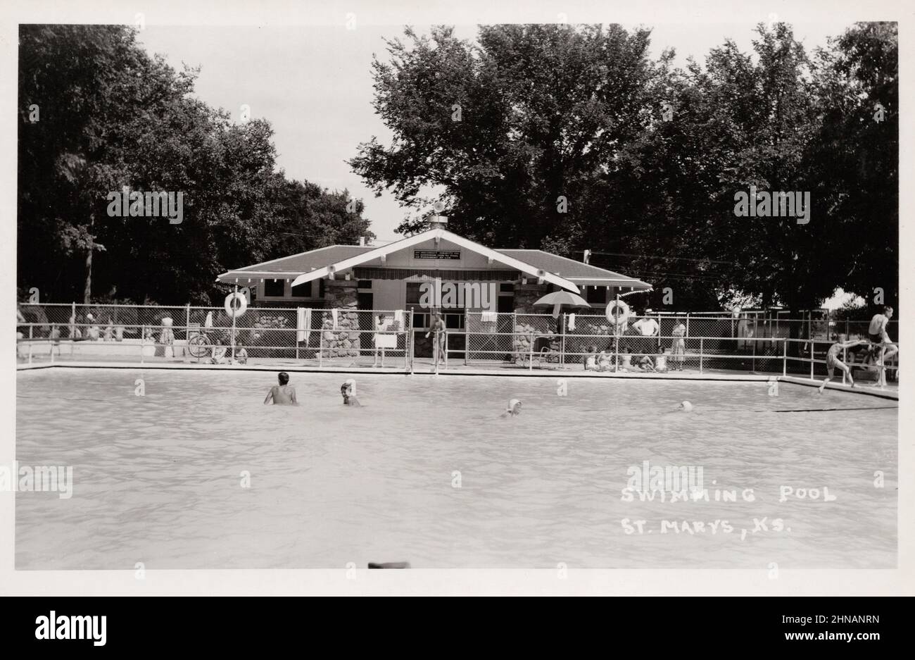 Swimmers in pool, St. Marys Kansas, unknown photographer, approx 1950's postcard Stock Photo