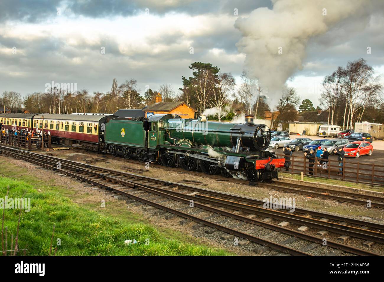 GWR 6959 Class 6990 Witherslack Hall with a southbound passenger train leaving Quorn on the Great Central Railway Stock Photo