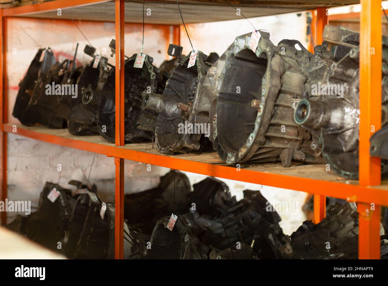 Used car parts on the store shelf. Used auto parts for sale in a store