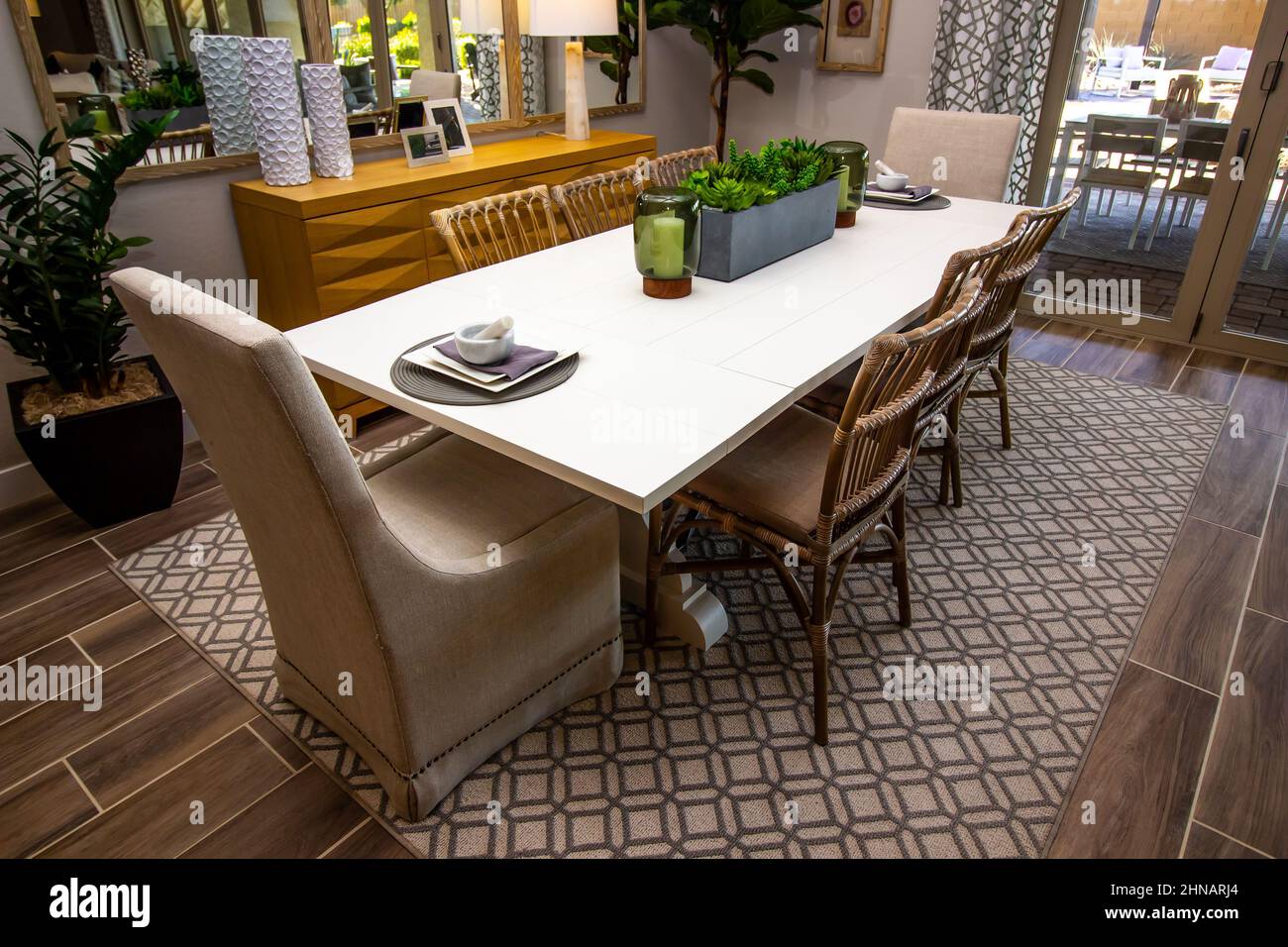 Dining Area With Eight Chairs On Decorator Rug Stock Photo