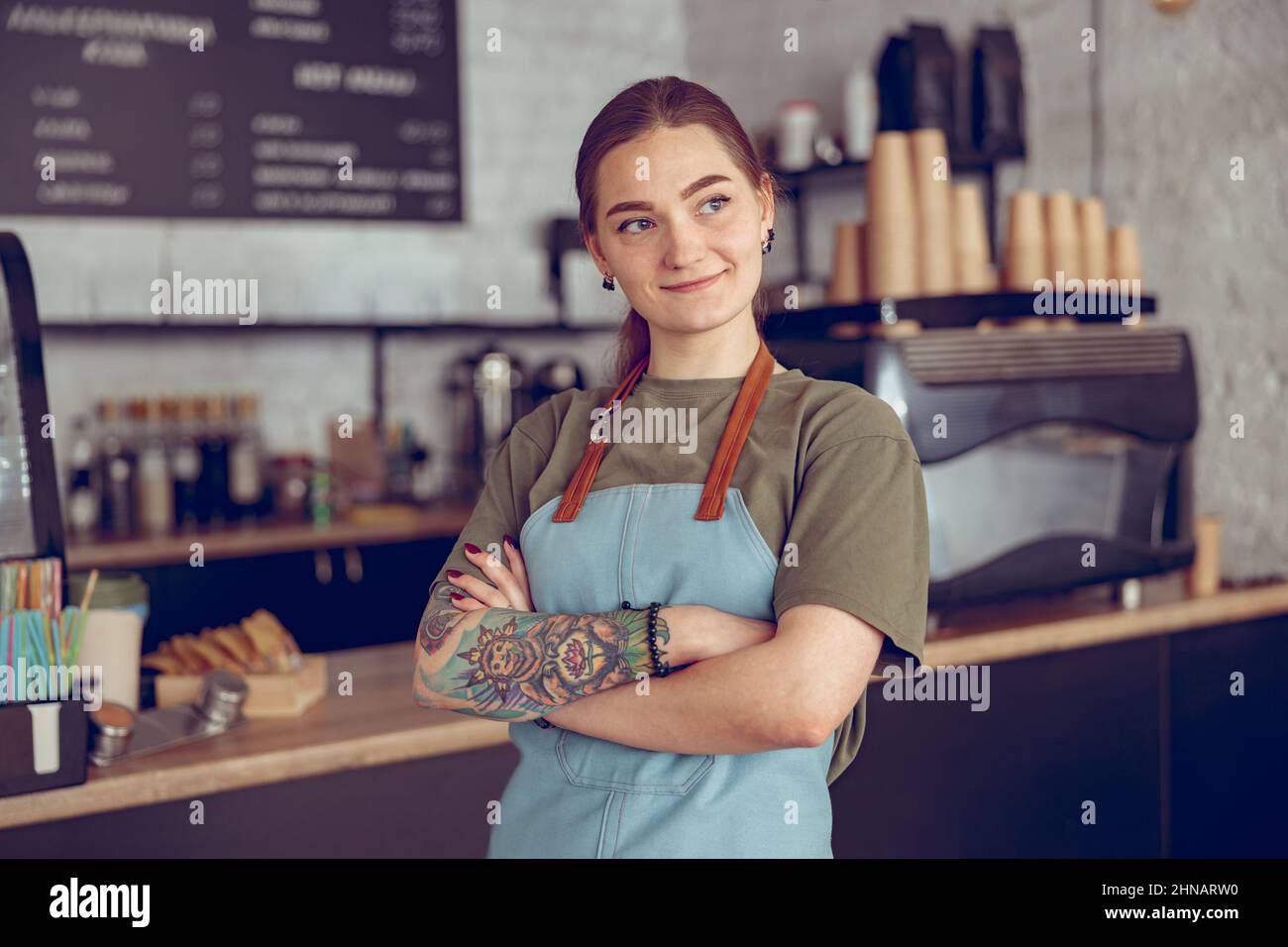 Positive female in apron hi-res stock photography and images - Alamy