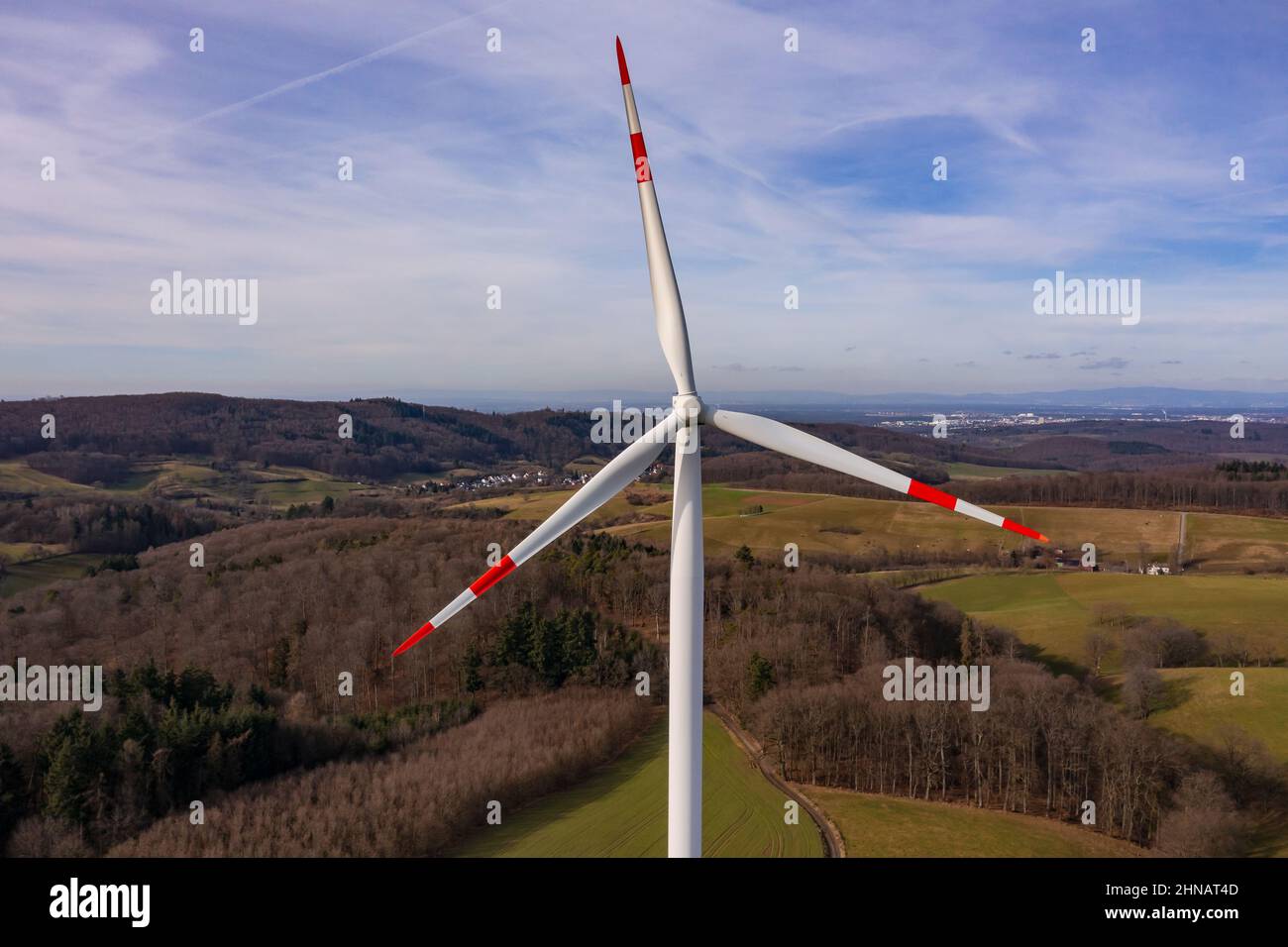 Aerial view of a wind turbine with the three rotor blades with good visibility in the background Stock Photo