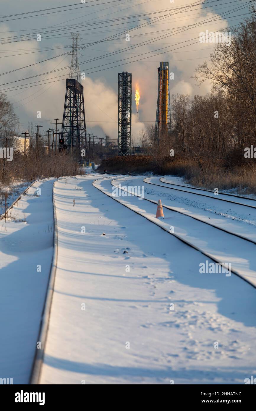 Detroit, Michigan - Railroad tracks lead to the U.S. Steel mill on Zug Island, where gas is flared. The mill now employs only a fraction of the 16,000 Stock Photo