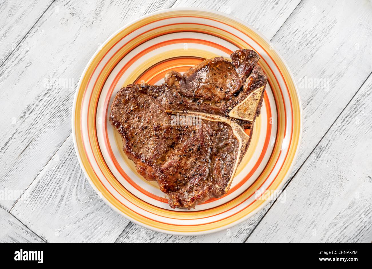 Panfried Tbone steak with pepper on the plate Stock Photo Alamy