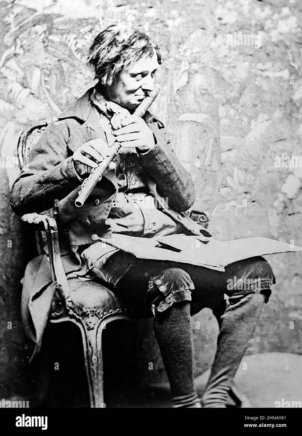 An itinerant Irish flute player, Victorian period Stock Photo