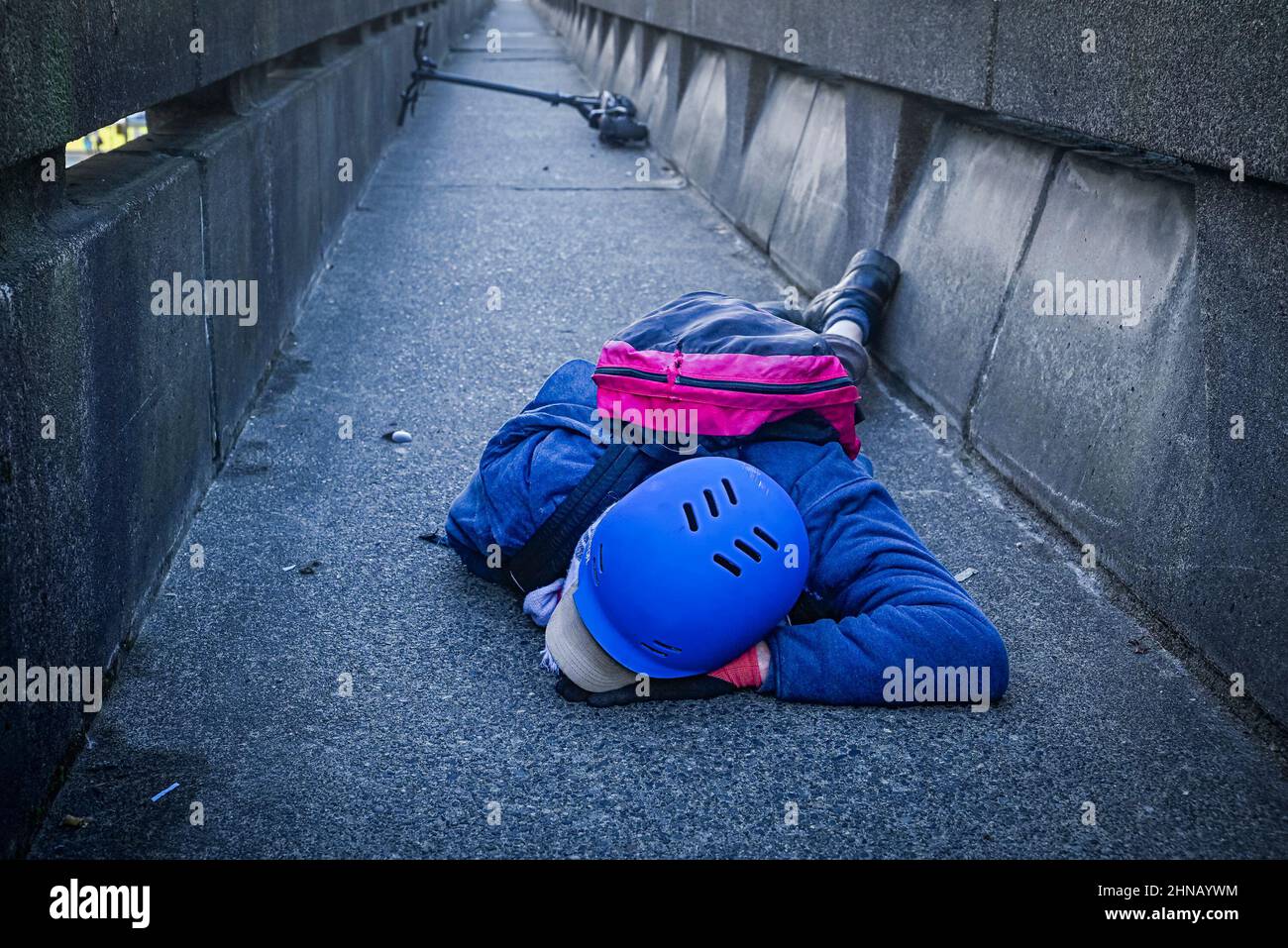 Young man injured in e-scooter accident Stock Photo