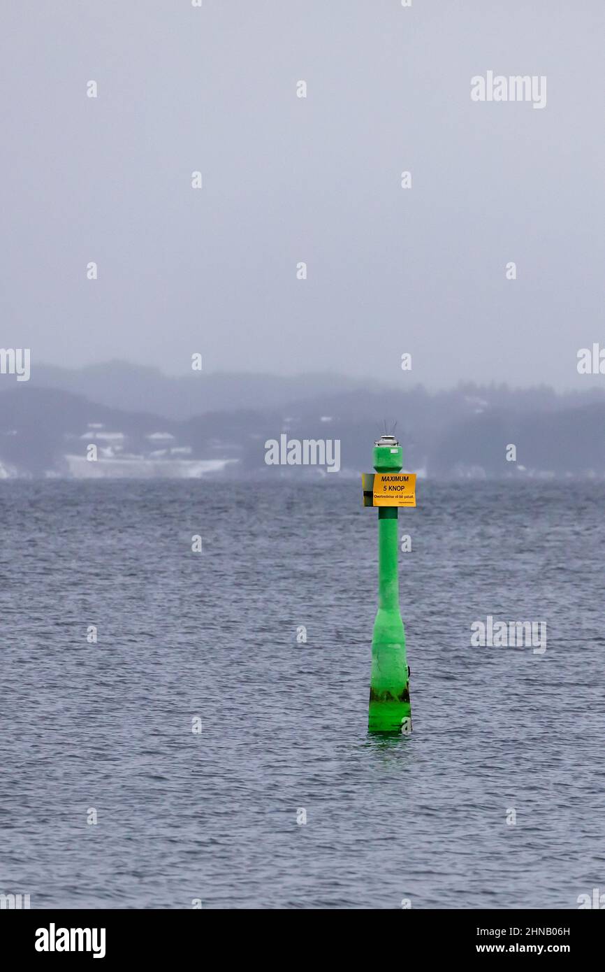 The buoy at Byfjorden, at the entrance to the port of Bergen, Norway. Advising of reduced speed beyond this buoy. Stock Photo
