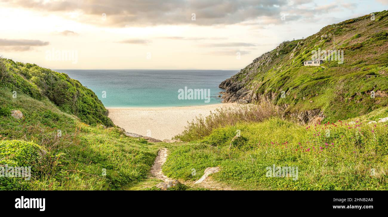 Panorama of Porthcurno Beach with the Minack Open Air Theatre in the background, Cornwall, England, UK Stock Photo