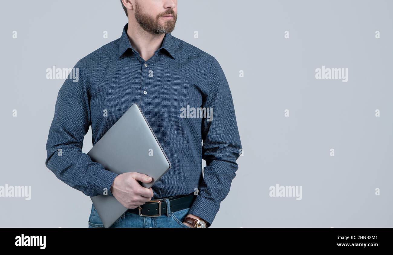 Bearded man cropped view in casual wear hold portable laptop computer, modern life, copy space Stock Photo