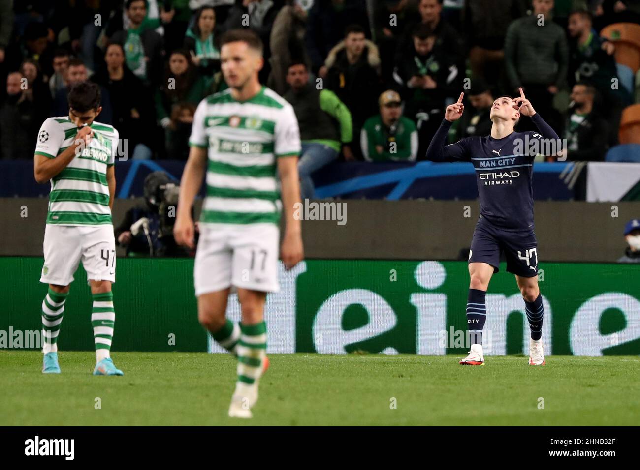 Lisbon, Portugal. 15th Feb, 2022. Phil Foden of Manchester City (R ) celebrates after scoring a goal during the Round Of Sixteen Leg One - UEFA Champions League match between Sporting CP and Manchester City at Alvalade stadium in Lisbon, Portugal, on February 15, 2022. (Credit Image: © Pedro Fiuza/ZUMA Press Wire) Stock Photo