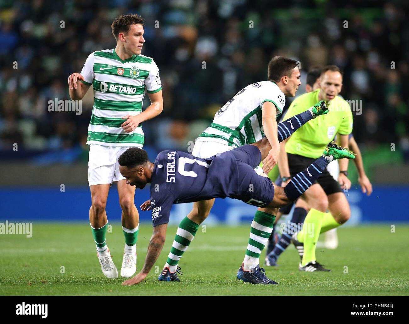 Manchester City's Raheem Sterling is tackled by Sporting Lisbon's Maria Joao Palhinha during the UEFA Champions League Round of 16 1st Leg match at the Jose Alvalade Stadium, Lisbon. Picture date: Tuesday February 15, 2022. Stock Photo