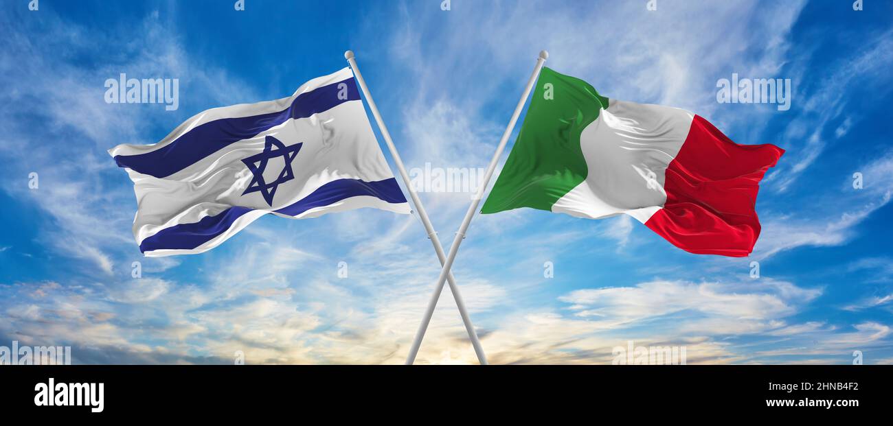 crossed national flags of Israel and Italia flag waving in the wind at ...