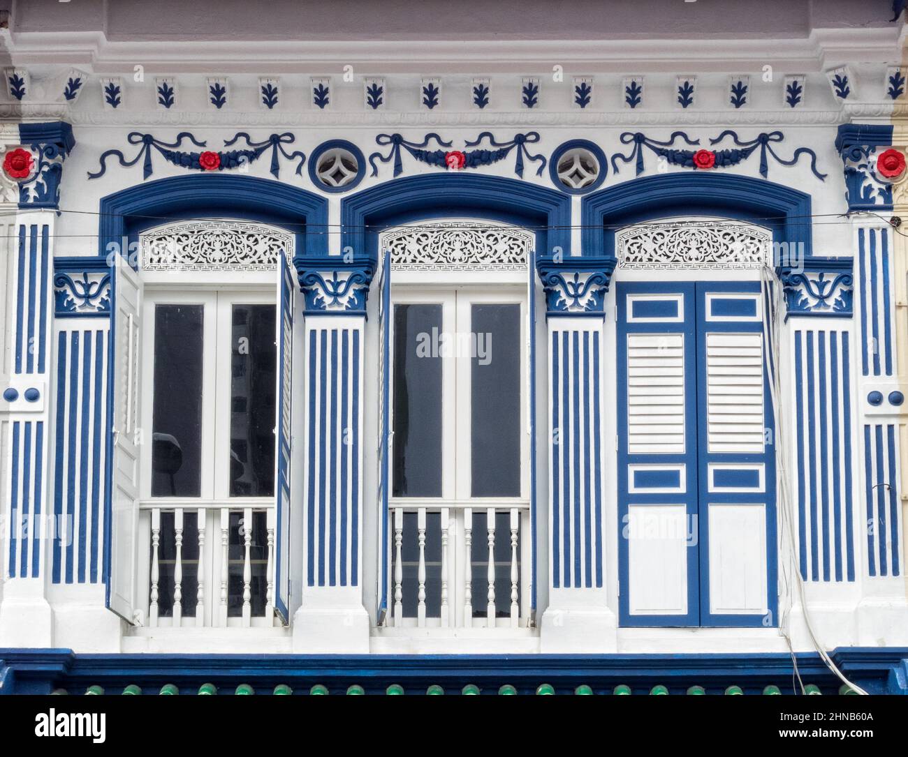 Traditional white and blue façade of a shophouse in Little India ...