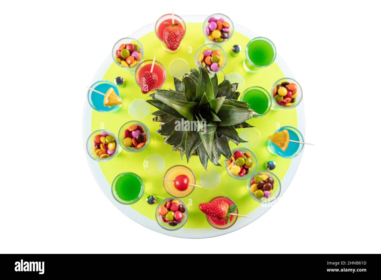 Variety of colorful green blue yellow red and white beautiful alcohol sweet shooters shots cocktail fresh beverage in small glasses. Alcoholic tropica Stock Photo