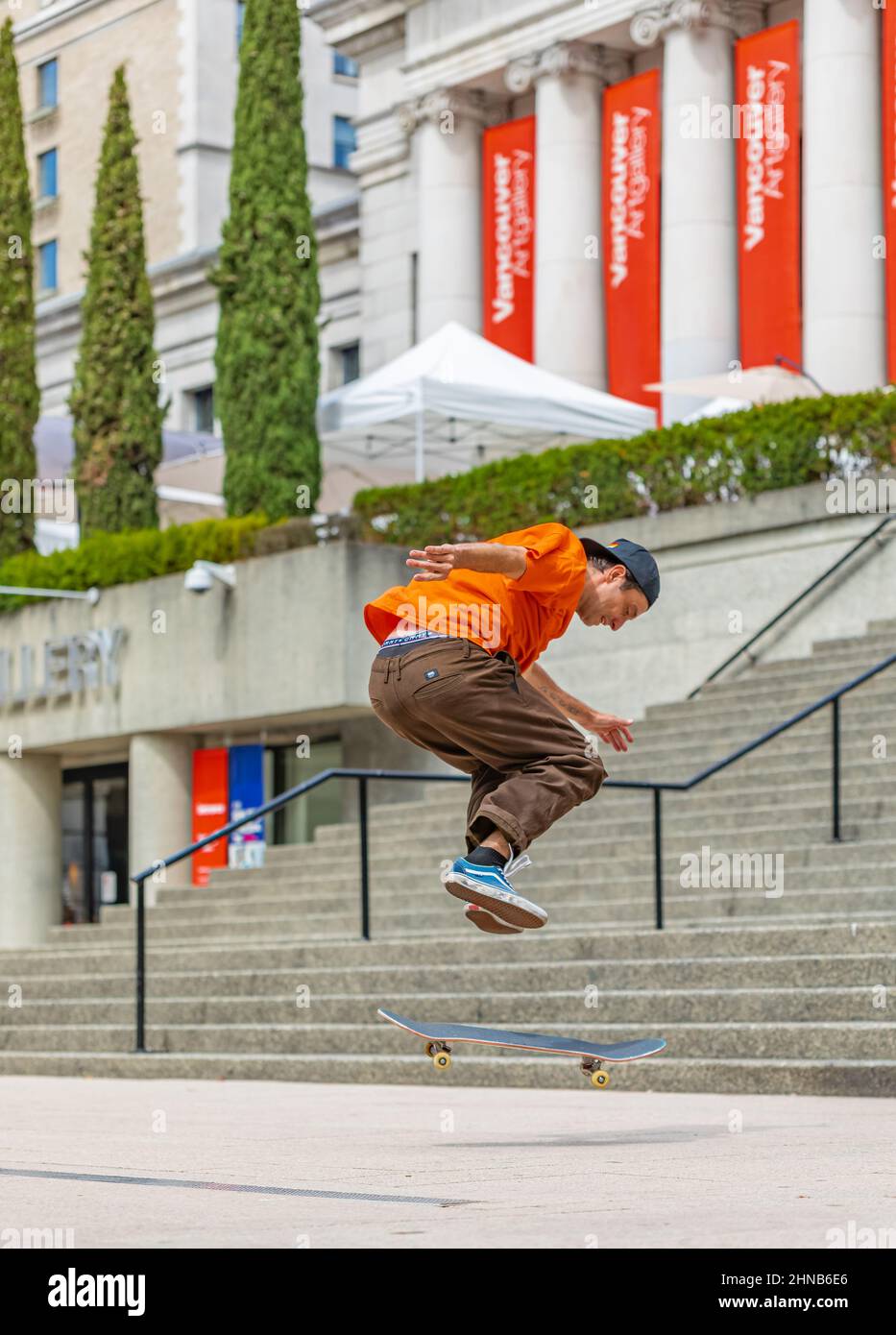 Skateboarder doing a skateboard jumping trick from stairs Stock Photo