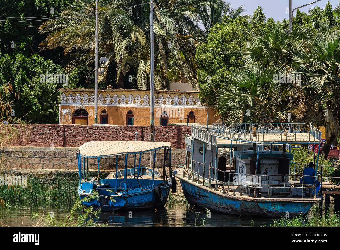 Passenger ferry boats anchored at the terminal in the town of Faris on the upper Nile, Aswan Governorate in Egypt Stock Photo