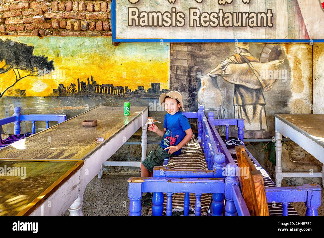 Enjoying a refreshing ice cream at the Ramsis Restaurant after a hot day in the sun at the Medinet Habu temple in Luxor Stock Photo