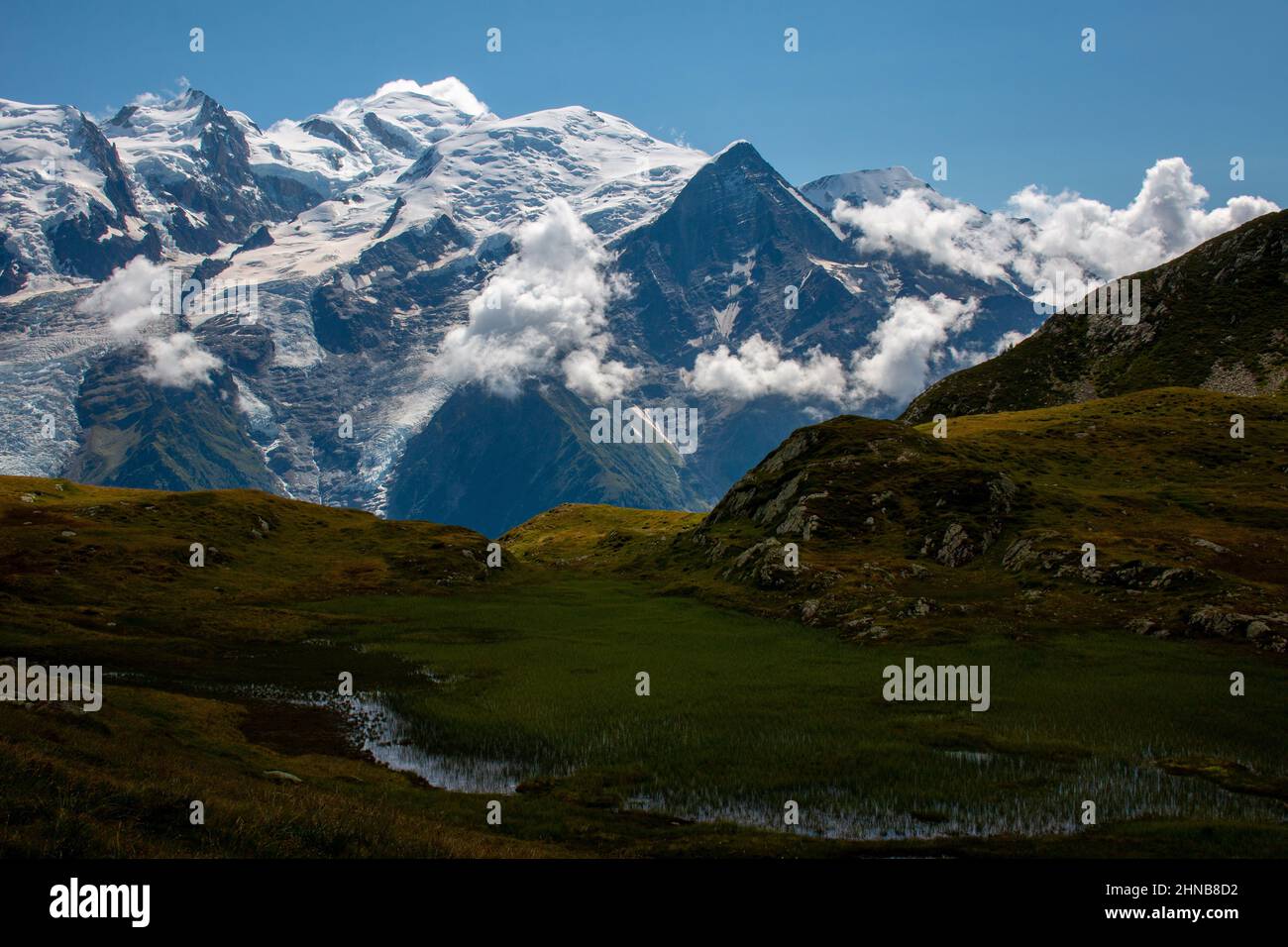 The view of Mont Blanc from the hiking trail between Refuge de Bellachat and Aiguillette des Houches, French Alps. Stock Photo