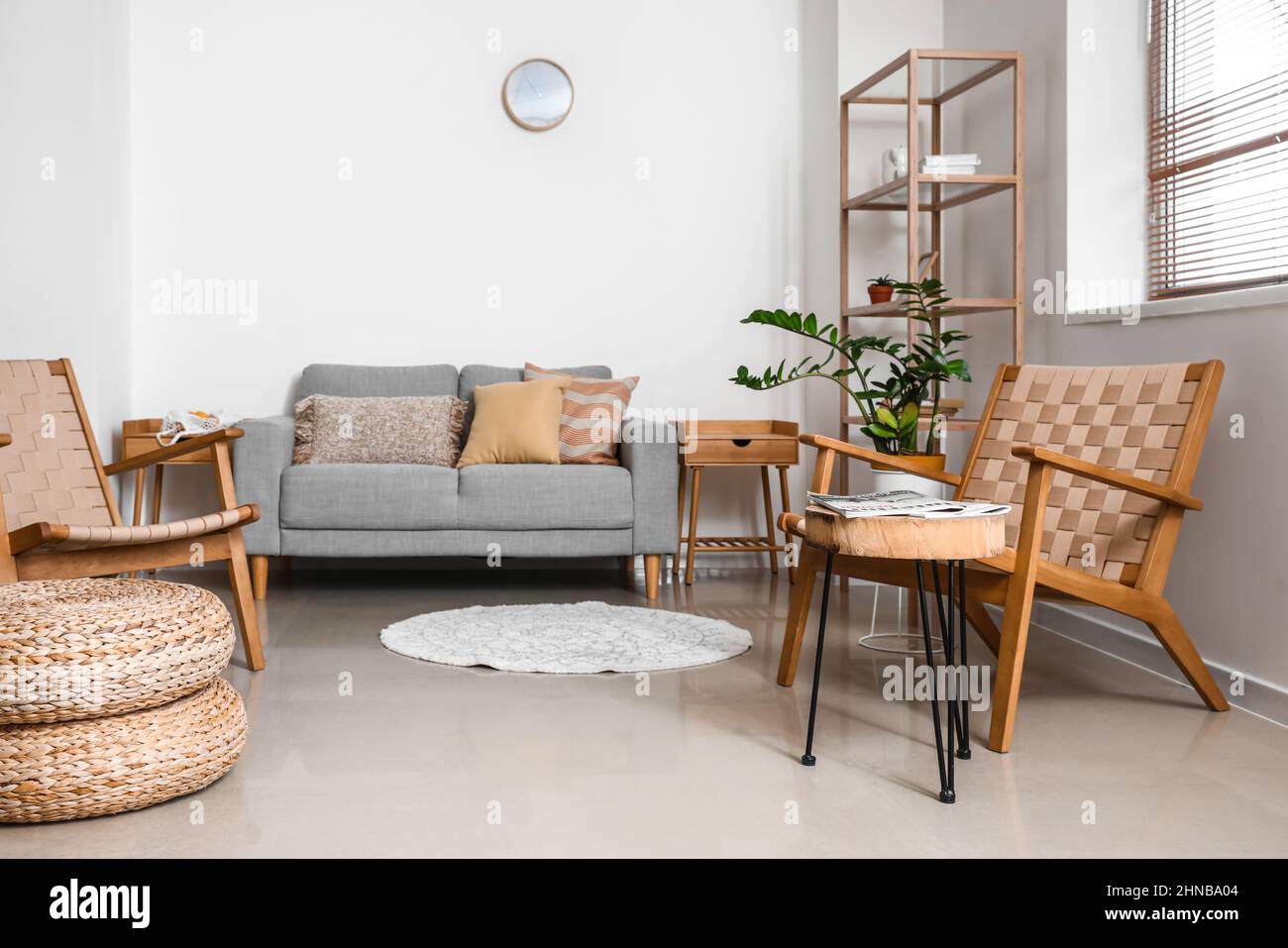 Interior of modern living room with sofa and wooden armchairs Stock ...