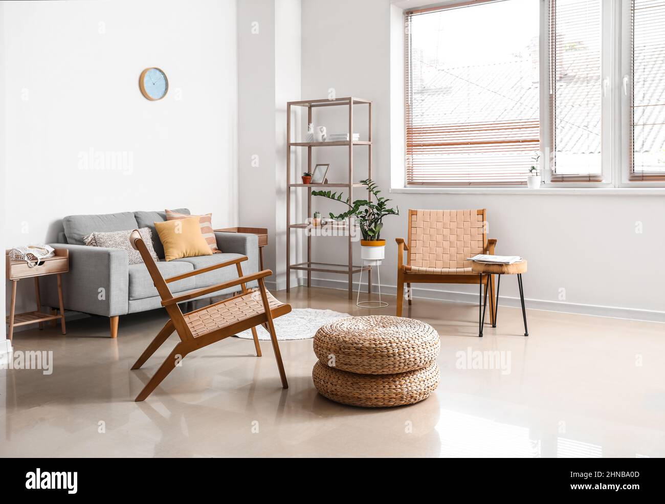 Interior of modern living room with sofa and wooden armchairs Stock ...