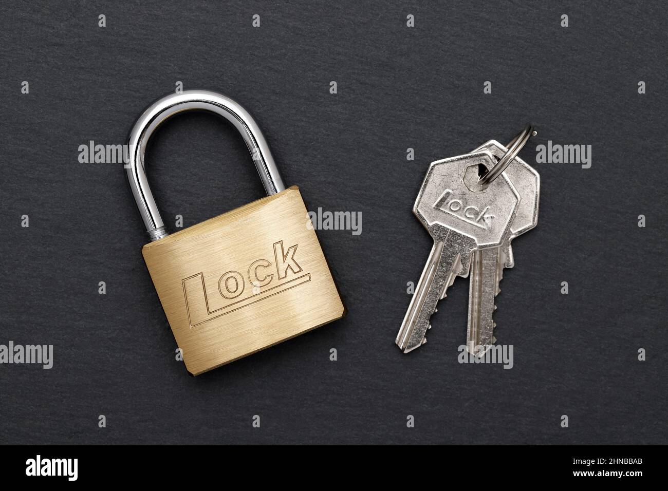 Lock and keys. Closeup of opened metal padlock with key inside isolated on  a white background. Macro photograph of metal lock with keys Stock Photo -  Alamy