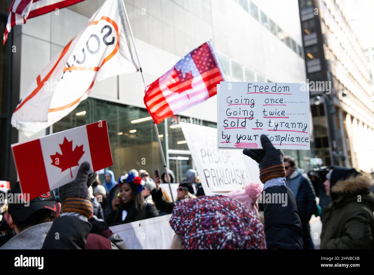 New York, United States. 15th Feb, 2022. Protesters hold Canadian flags during the demonstration.Demonstrators gathered at the Canadian Embassy to stand in solidarity with the Canadian truck blockade in Ottawa. Credit: SOPA Images Limited/Alamy Live News Stock Photo