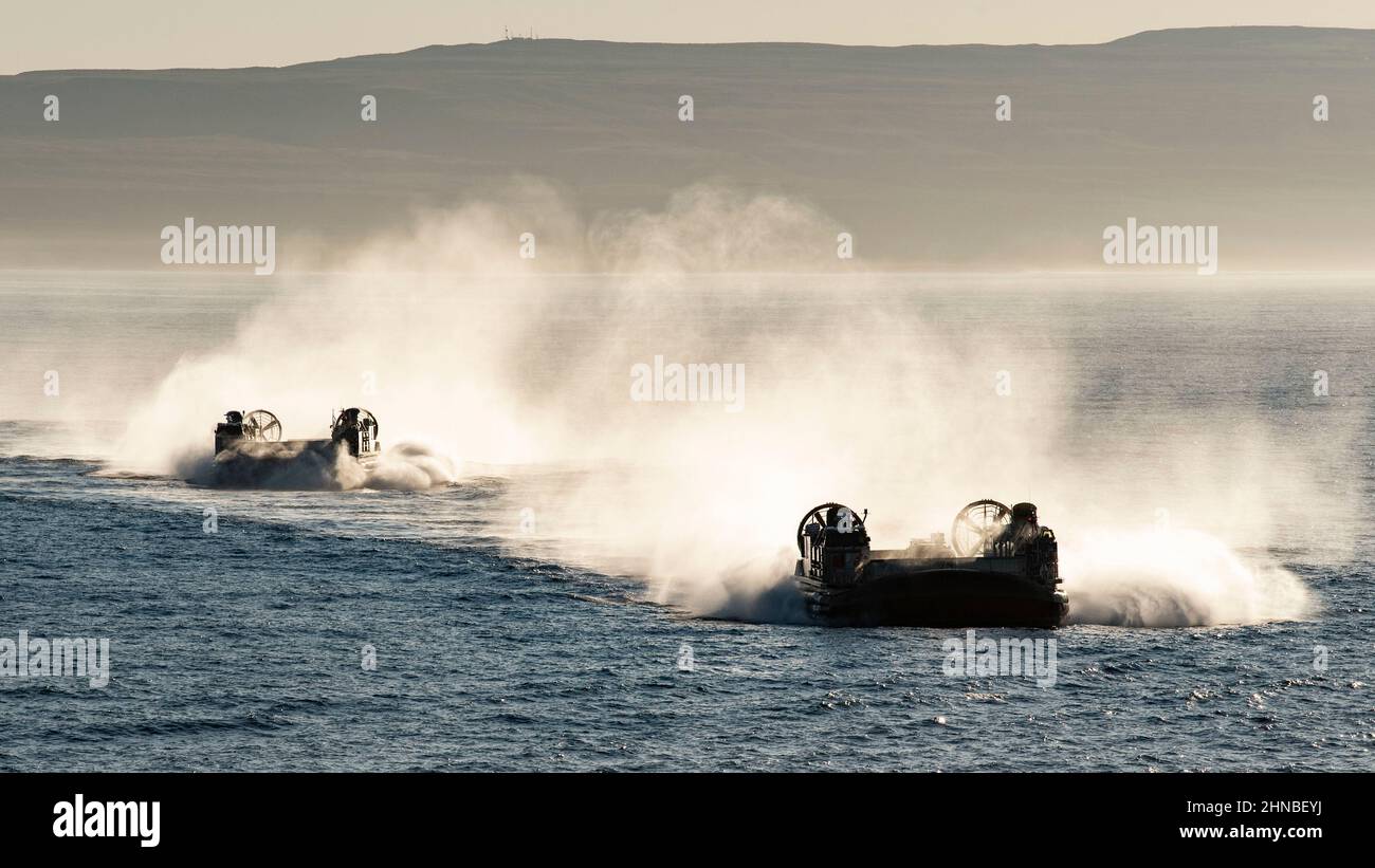 220209-N-WY048-1015    PACIFIC OCEAN (Feb. 9, 2022) – Landing craft, air cushions assigned to Assault Craft Unit (ACU) 5 approach amphibious transport dock ship USS Anchorage (LPD 23), Feb. 9.  Anchorage is underway conducting routine operations in U.S. 3rd Fleet. (U.S. Navy Photo by Mass Communication Specialist 2nd Class Hector Carrera) Stock Photo