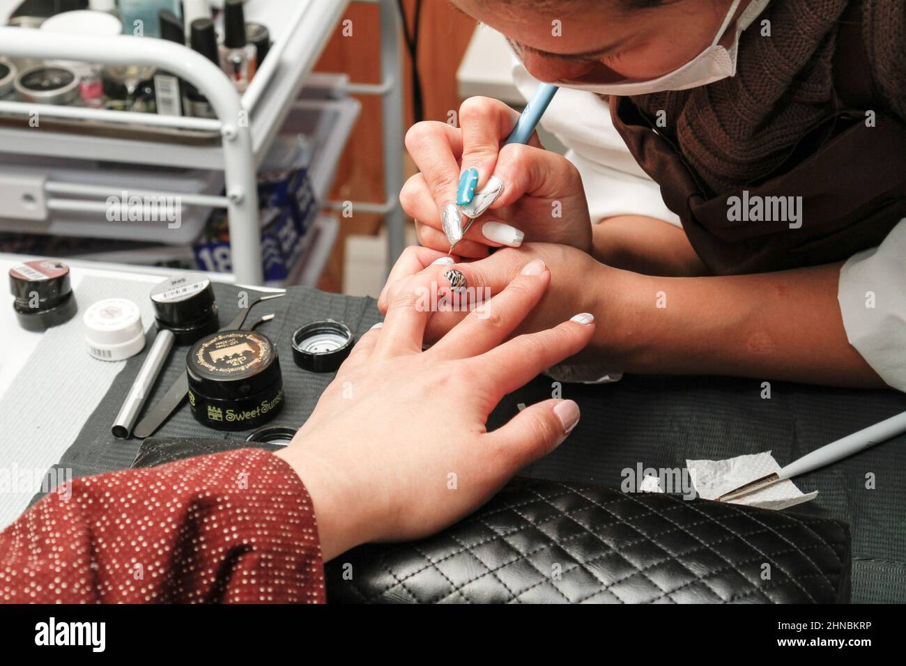 nagano, japan, 2022/12/02 , Nail art is a creative way to paint, decorate, enhance, and embellish nails. It is a type of artwork that can be done on f Stock Photo