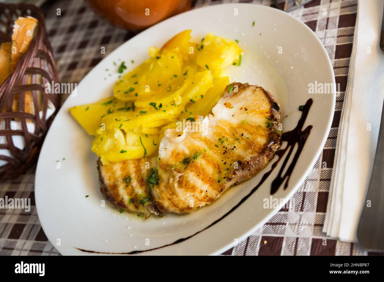Roasted shark steak with salsa verde Stock Photo