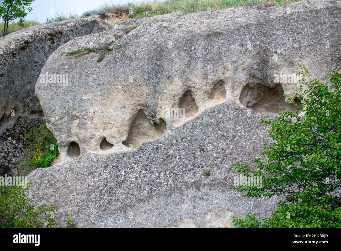 carved mountains and rocks in uplistsikhe in georgia Stock Photo