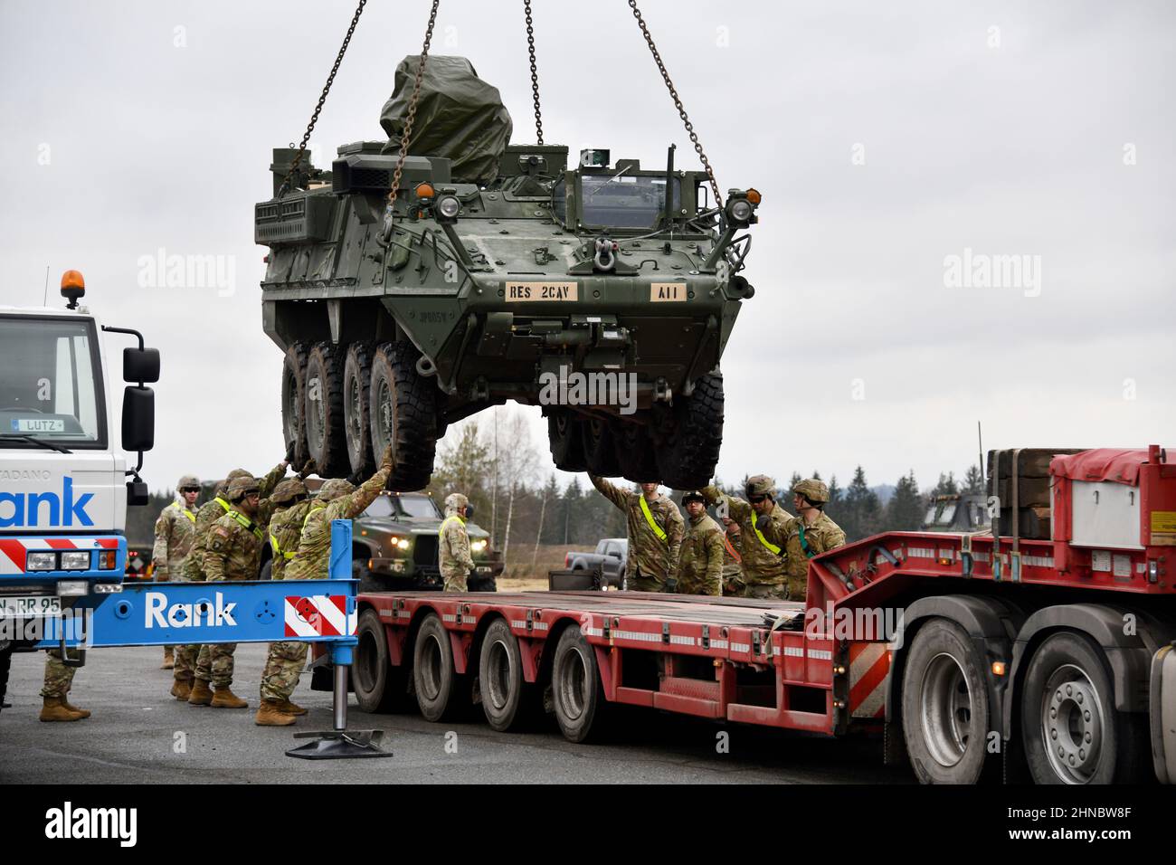 Vilseck, Germany . 09 February, 2022. U.S. Army soldiers assigned to the 2nd Squadron, 2nd Cavalry Regiment load a Stryker armored vehicle onto a truck at the 7th Army Training Command Rose Barracks Air Field for deployment to Romania, February 9, 2022 in Vilseck, Germany. The soldiers are deploying to Eastern Europe in support of NATO allies and deter Russian aggression toward Ukraine. Credit: Gertrud Zach/U.S Army/Alamy Live News Stock Photo