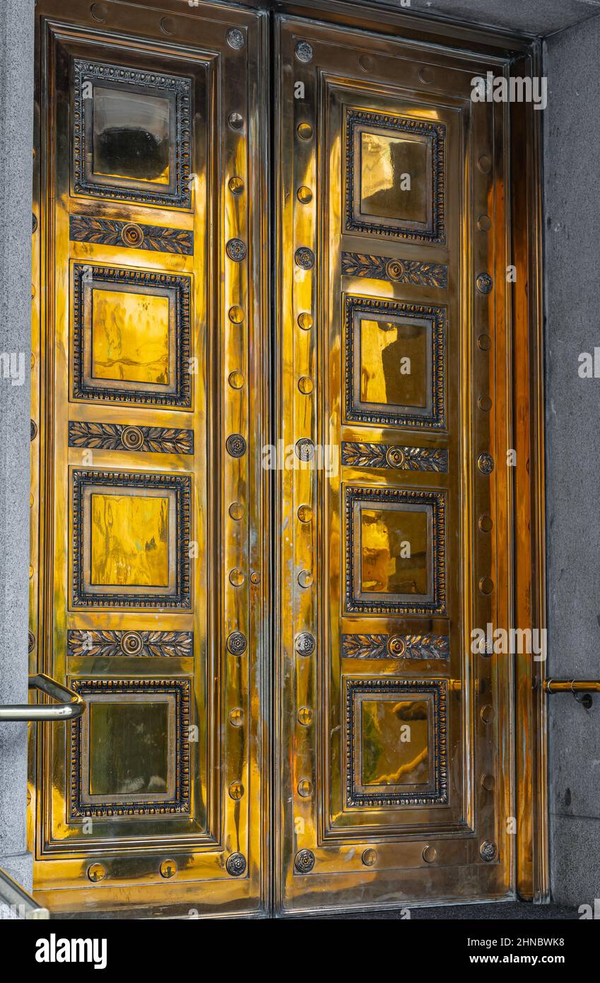 The golden ornamental door details. Close up of an old gold color doors